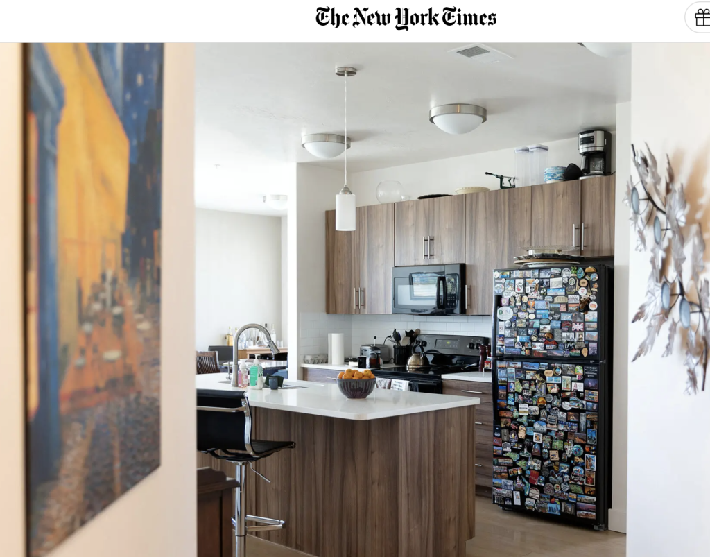 Image shows the apartment of someone renting forever. The kitchen is prominent, featuring a fridge with magnets.